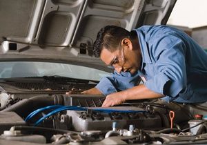 Mechanic working on car