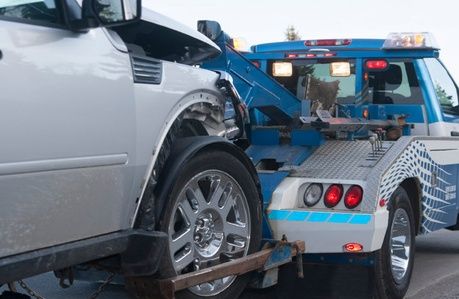 Photo of tow truck towing vehicle